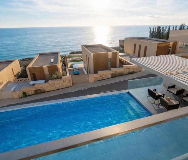 Modern seaside villa with swimming pool overlooking the Mediterranean Sea and surrounding landscape